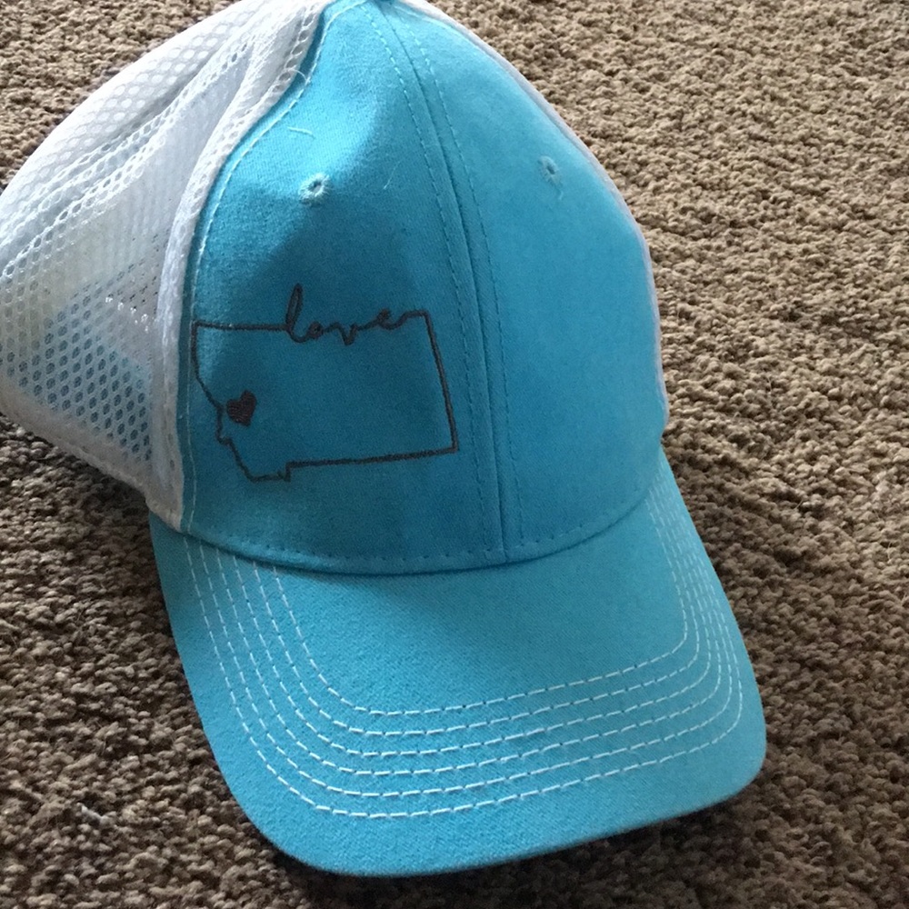 Light blue MT brand apparel hat.